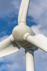 Detailed close up view of a wind turbine; generator, rotor and blade