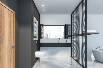 Gray and white bathroom with toilet and door