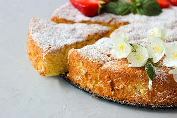 Orange cake decorated with strawberries