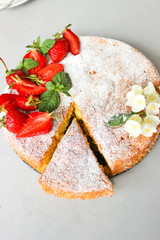 Orange cake decorated with strawberries