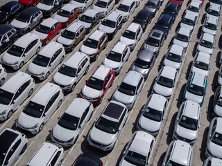 New cars parking lot, aerial view, sunny day