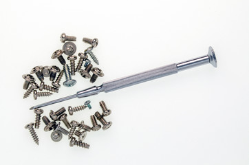 a small screwdriver is stainless steel and a lot of small cogs - 270844804