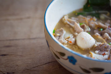  Thai noodle soup,Tom Yum in bowl on wooden background with copy space.