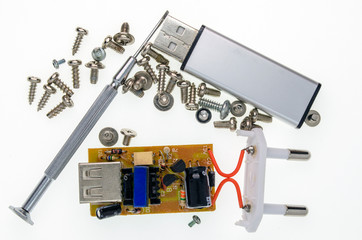 phone charger removed from the case, flash drive, screwdriver and screws - 270845206