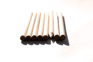 8 pencils are on the table in bright daylight. Natural unpainted wood. Eco-friendly materials. Not like everyone else
