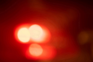 Red blurred background with light spots