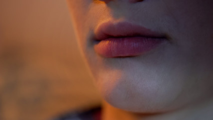 Close-up of human lips and chin, beauty shots with botox or hyaluronic acid