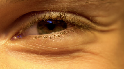 Fototapeta premium Young person having poor vision, squinting eyes, ophthalmology, extreme close-up