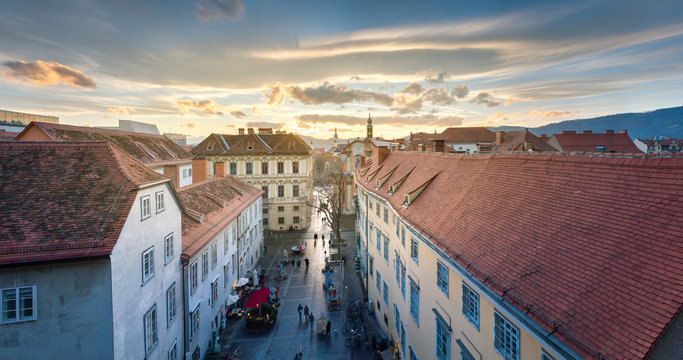 GRAZ, AUSTRIA: View of traditional roofs at sunset in winter.