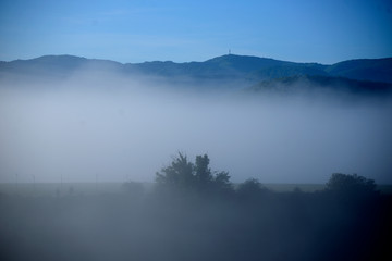 spring sunrise. The fog dissolves slowly and the sun begins to shine. Vitoria-Gasteiz (Alava), Basque Country, Spain. cerro de las neveras, anillo verde. (hill of refrigerators, green ring)