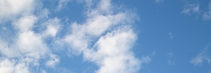 Naklejka na ściany i meble Background of clouds on blue sky.