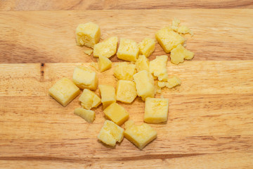 Isolated piece of cheese on Board