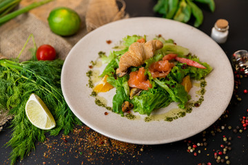 Healthy salad plate. Fresh seafood recipe. Grilled shrimps and fresh vegetable salad and egg. Grilled prawns. Healthy food. Flat lay. Top view. Black background . Slow-mo.