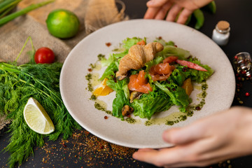 Healthy salad plate. Fresh seafood recipe. Grilled shrimps and fresh vegetable salad and egg. Grilled prawns. Healthy food. Flat lay. Top view. Black background . Slow-mo.