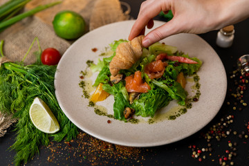 Healthy salad plate. Fresh seafood recipe. Grilled shrimps and fresh vegetable salad and egg. Grilled prawns. Healthy food. Flat lay. Top view. Black background . Slow-mo.