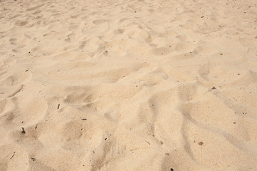 Fototapeta na wymiar Fine and warm sand on a beach.