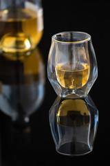 Whiskey glass on black background