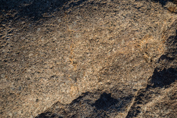 Background of natural stone. A snapshot of granite boulder (Latin 