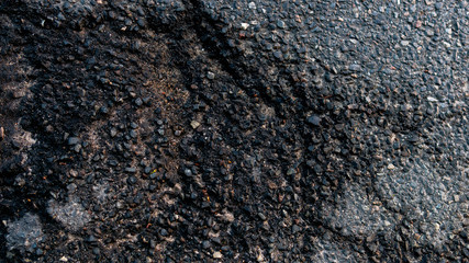 Power texture of asphalt. Natural color and structure. Road. Close