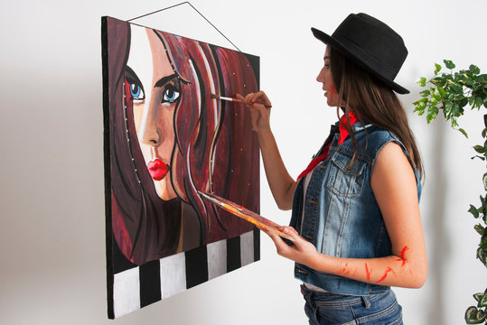 Young girl teenage woman painting paint, creative art concept hobbies 