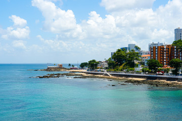 Coastline city of Salvador Bahia, Brazil. Boardwalk coast next the Barra lighthouse and Santa Maria Fort.