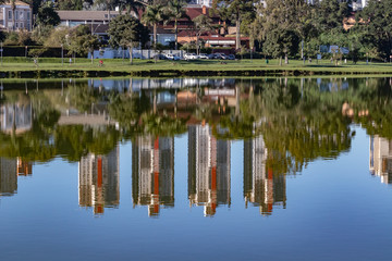Fototapeta na wymiar Buildings reflecting on the pond