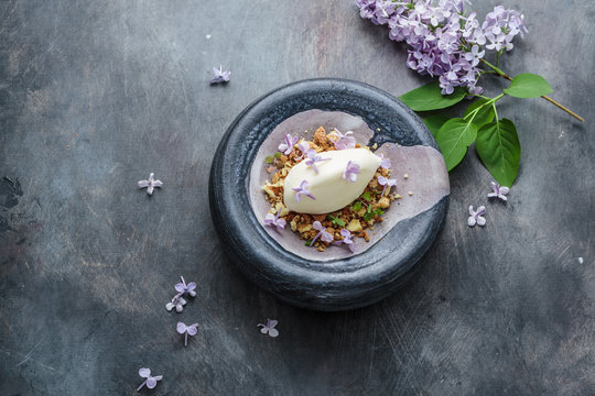 Ice cream with lilac flowers, restaurant disg, copy space