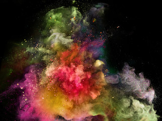 Fototapeta na wymiar Colored powder explosion on black background. Freeze motion.