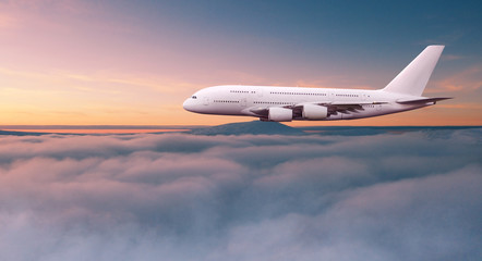 Huge two-storey passengers commercial airplane flying above dramatic clouds. Travel and business...
