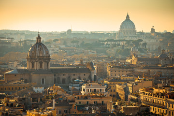 Eternal city of Rome rooftops and towers golden sunset view