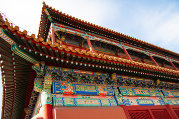 Impressive colorful elaborate roof from the forbidden city in Beijing, China. The colors of the...