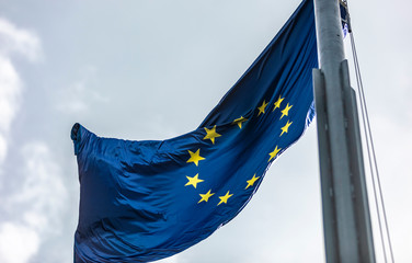 EU flag waving in front of blue summer sky. Budapest, Hungary