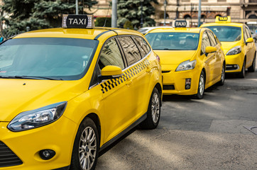 Many yellow taxi cars standing on the Hungarian road