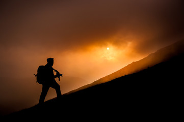 Photographer silhouette at sunset