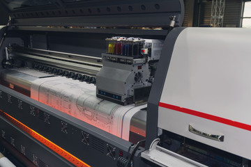 Large format printing machine in operation. Industry