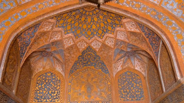 Amazing, beautiful architectural details and patterns on the walls and ceiling inside the ancient Indian temple in one of the buildings in complex Taj Mahal, Agra, India