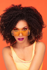 Fototapeta premium Beauty portrait of afro girl in fashionable sunglasses.