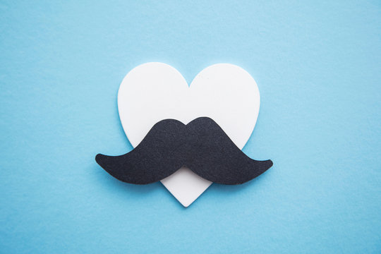 Black mustache with love hearts. Father's day or mens health concept