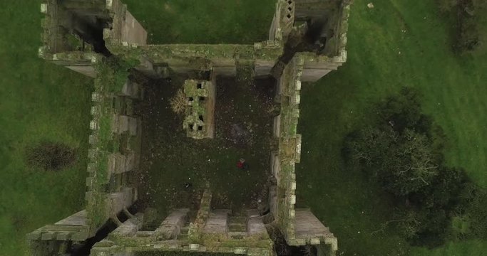Aerial top down of Raphoe Castle, the bishops palace ruins, moss growing on old brick walls
