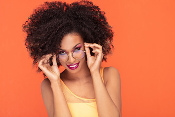 Beauty portrait of afro girl in fashionable eyeglasses.