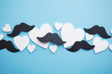 Black mustache with love hearts. Father's day or mens health concept