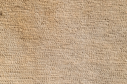 Texture of processed ancient marble block. Traces of ancient tools