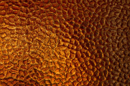 Glowing amber colored patterned glass