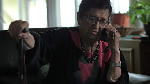 Grandma is talking on the phone