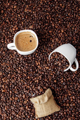Coffee cup with coffee bag on wooden table. View from top