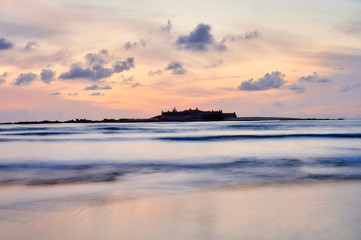 Fototapeta premium Beach of moledo at the end of the day, with a view to trega mountain on spanish side of the border. Low tide displaying the sandy beach on a cloudy day.