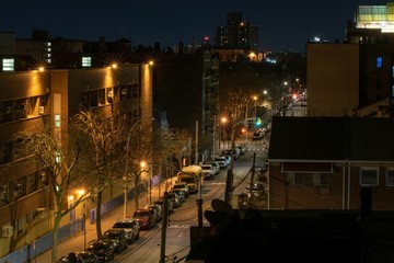 Fototapeta na wymiar A calm and very quiet street during the night, Bronx, NY, USA
