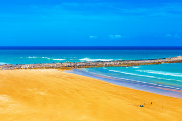 View of the ocean and the breakwaters that separate the mouth of the Bou Regreg river from the Atlantic Ocean. Rabat, Morocco.