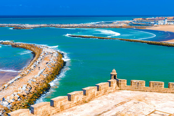 View of the ocean and the breakwaters that separate the mouth of the Bou Regreg river from the Atlantic Ocean. Rabat, Morocco.
