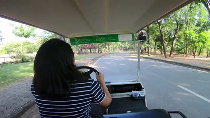 Hyperlapse of driving golf cart in the park - Powered by Adobe